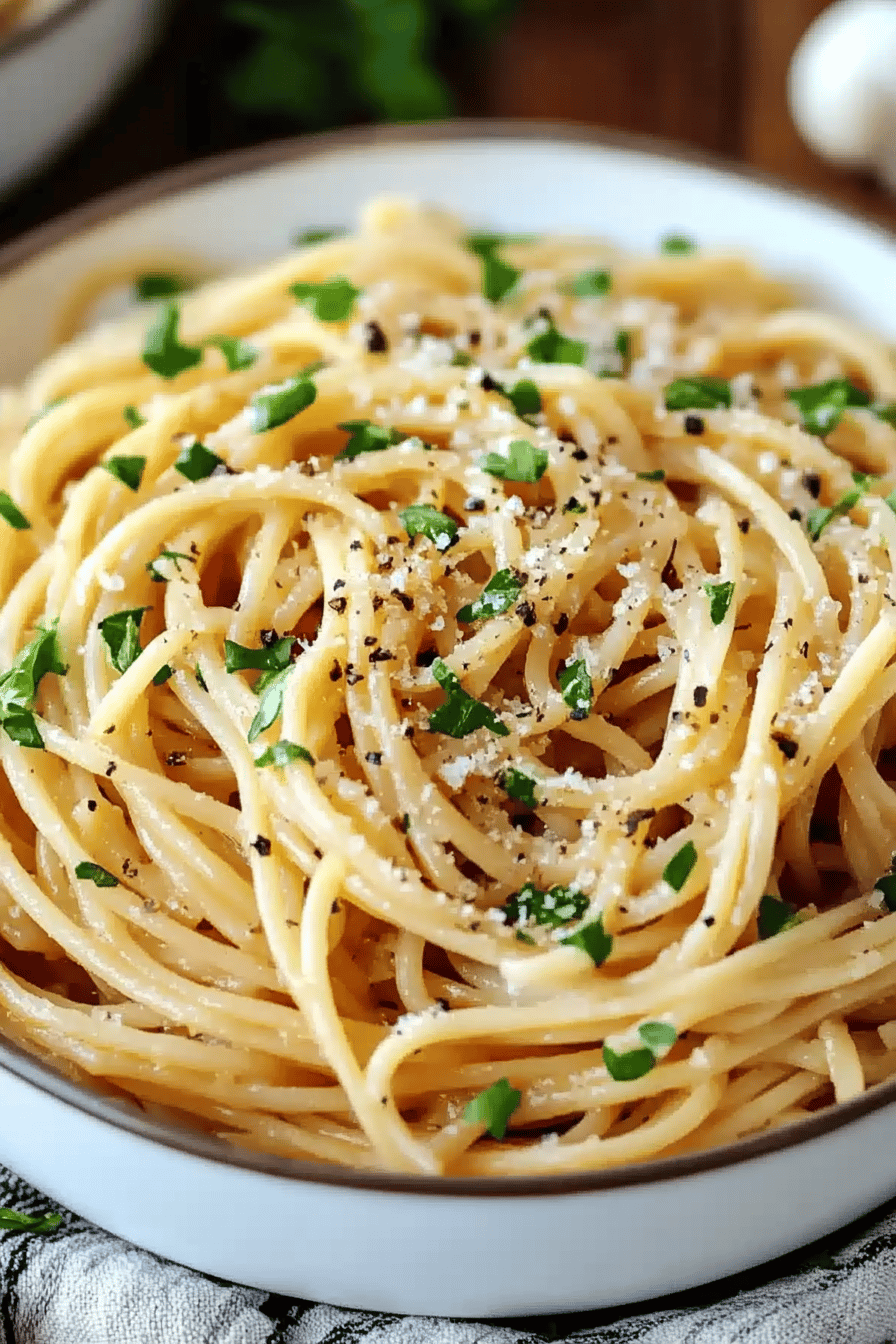 Garlic Noodles Recipe slice on plate showing perfect texture and swirl pattern