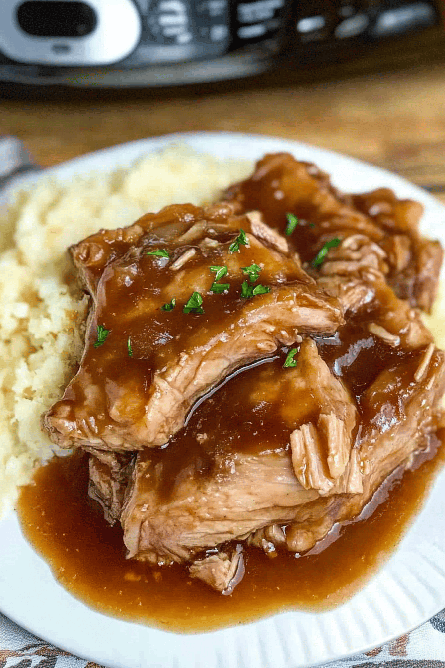 Slow Cooker Pork Chops slice on plate showing perfect texture and swirl pattern